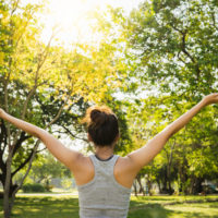 Healthy young Asian runner woman warm up the body stretching bef